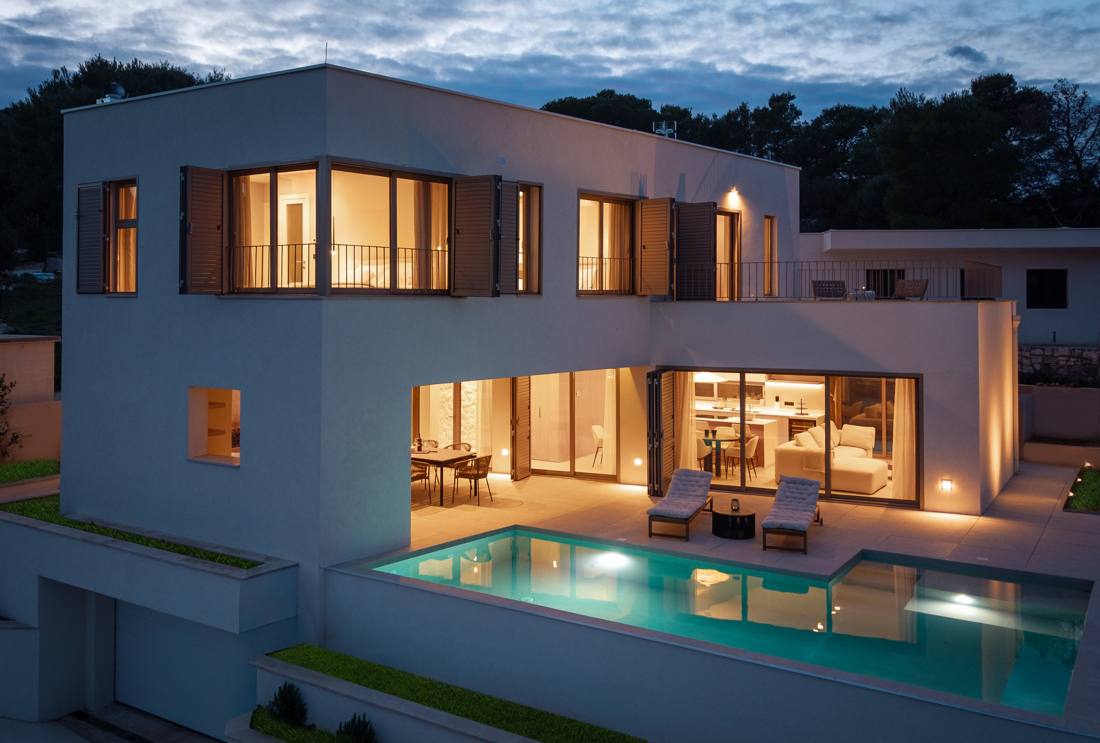 Lemon Tree Villa at dusk with the pool lit up